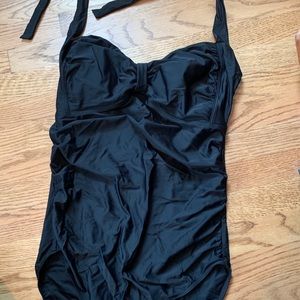 Woman’s maternity one piece swimsuit.